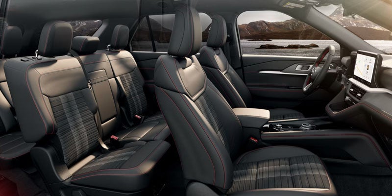 A Ford Explorer parked, showcasing its sleek design and sporty features in a modern urban setting.
